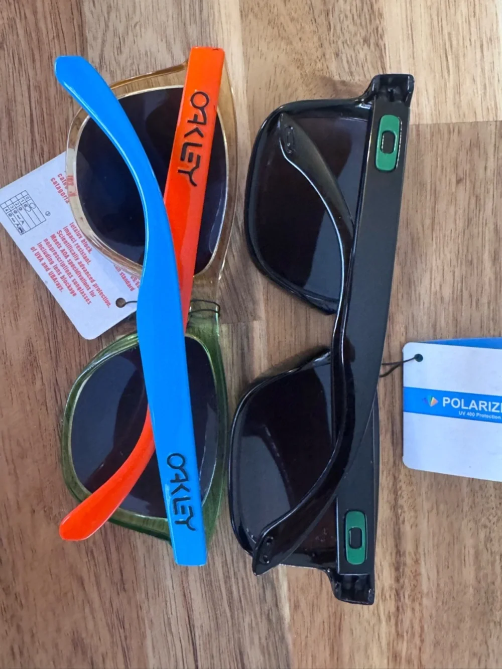2 Oakley style kids Sunglasses polarized lenses. Not sure if authentic NWT